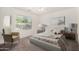 Serene bedroom with ample natural light, cozy decor, and a calming color palette, enhancing comfort at 1501 S 122Nd Ave, Avondale, AZ 85323