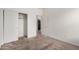 This bedroom includes a closet with sliding doors and access to the kitchen and bathroom at 1501 S 122Nd Ave, Avondale, AZ 85323