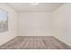 This spacious bedroom offers plush carpeting and a window with natural light at 1501 S 122Nd Ave, Avondale, AZ 85323