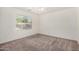 Neutral-toned bedroom with a window, carpeted floors, and natural light at 1501 S 122Nd Ave, Avondale, AZ 85323
