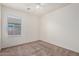 This bedroom features a window offering great natural light and neutral carpet at 1501 S 122Nd Ave, Avondale, AZ 85323
