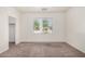 This bedroom has a nice window view to the outside and neutral carpeting at 1501 S 122Nd Ave, Avondale, AZ 85323