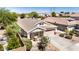 Inviting home featuring a well-kept lawn, desert landscaping, and a two-car garage at 1501 S 122Nd Ave, Avondale, AZ 85323