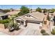 Charming home with a spacious driveway, lush landscaping, and a welcoming facade at 1501 S 122Nd Ave, Avondale, AZ 85323