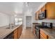 A modern kitchen featuring stainless steel appliances and barstool seating at 1501 S 122Nd Ave, Avondale, AZ 85323
