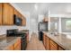 Modern kitchen with granite counters and stainless steel appliances at 1501 S 122Nd Ave, Avondale, AZ 85323