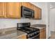 Close-up of a stainless steel gas range and microwave oven at 1501 S 122Nd Ave, Avondale, AZ 85323