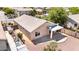 A rear exterior shot showcasing a covered patio and low-maintenance landscaping at 1501 S 122Nd Ave, Avondale, AZ 85323