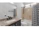 Bathroom with granite counters, framed mirror, tile backsplash, and tub with shower curtain for a clean aesthetic at 1641 W Windsong Dr, Phoenix, AZ 85045