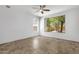 Well-lit bedroom featuring tile flooring, a ceiling fan, and bright windows at 1641 W Windsong Dr, Phoenix, AZ 85045