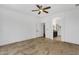 Main bedroom with tile flooring, and a view to the ensuite bathroom at 1641 W Windsong Dr, Phoenix, AZ 85045