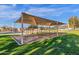 Covered community swing set provides a fun area for neighborhood residents at 1641 W Windsong Dr, Phoenix, AZ 85045