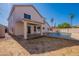 View of the patio and backyard with a pool under a sunny blue sky at 16609 S 41St St, Phoenix, AZ 85048
