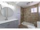 Updated bathroom featuring a round mirror, granite countertops, and a standing shower with tile surround at 16609 S 41St St, Phoenix, AZ 85048