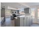 Updated kitchen with gray cabinets, stainless steel appliances, and quartz countertops at 16609 S 41St St, Phoenix, AZ 85048