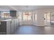 Bright eat-in kitchen features gray cabinets, quartz countertops, and sliding door access to the patio at 16609 S 41St St, Phoenix, AZ 85048