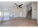 Spacious living room with vinyl plank flooring, vaulted ceiling, and staircase at 16609 S 41St St, Phoenix, AZ 85048