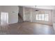Bright living room with vaulted ceilings, luxury vinyl plank flooring, and plantation shutters at 16609 S 41St St, Phoenix, AZ 85048