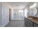 Beautiful primary bathroom showcasing a walk-in shower, single sink, and updated tile at 16609 S 41St St, Phoenix, AZ 85048
