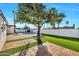 Green backyard with pavers and pool with a large tree at 1720 W Highland St, Chandler, AZ 85224