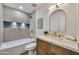 Stylish bathroom with a tub, shower, and well-lit vanity at 1720 W Highland St, Chandler, AZ 85224
