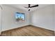 Empty bedroom featuring wood floors and a view of the street at 1720 W Highland St, Chandler, AZ 85224