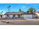 Charming single-story home featuring a low-maintenance desert landscape and an attached two-car garage at 1720 W Highland St, Chandler, AZ 85224