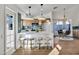 Stylish kitchen featuring pendant lighting, a breakfast bar, and modern appliances with dining area at 1720 W Highland St, Chandler, AZ 85224