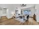 Bright living room features wood floors, vaulted ceilings, modern decor, and large windows at 1720 W Highland St, Chandler, AZ 85224