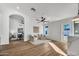Spacious living area with wood floors and ample natural light from windows and a glass door at 1720 W Highland St, Chandler, AZ 85224