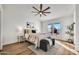 Relaxing main bedroom with a ceiling fan, outside view, and comfortable decor at 1720 W Highland St, Chandler, AZ 85224