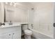 Bright bathroom features a modern vanity, sizable mirror, and a shower-over-tub combination at 1727 W 12Th Ave, Apache Junction, AZ 85120