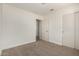 Carpeted bedroom featuring a closet and doorway at 1727 W 12Th Ave, Apache Junction, AZ 85120