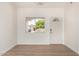 Bright entryway featuring a new door, window, and stylish flooring at 1727 W 12Th Ave, Apache Junction, AZ 85120