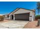 Charming single-story home with a two-car garage and low-maintenance desert landscaping at 1727 W 12Th Ave, Apache Junction, AZ 85120