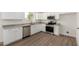 Modern kitchen with stainless steel appliances, granite countertops, and stylish white cabinetry at 1727 W 12Th Ave, Apache Junction, AZ 85120