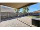Backyard patio with built-in outdoor grill and artificial turf lawn at 17426 W Calavar Rd, Surprise, AZ 85388