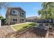 Backyard with artificial turf, rock landscaping, and an outdoor seating area at 17426 W Calavar Rd, Surprise, AZ 85388