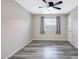 Bedroom featuring a ceiling fan, window and light gray vinyl floors at 17426 W Calavar Rd, Surprise, AZ 85388