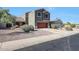 Charming two-story home with a well-maintained yard and a red garage door at 17426 W Calavar Rd, Surprise, AZ 85388