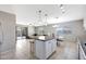 An open layout showing the kitchen, dining and living areas with backyard access at 17426 W Calavar Rd, Surprise, AZ 85388