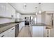 Modern kitchen featuring granite countertops, stainless steel appliances, and ample cabinet space at 17426 W Calavar Rd, Surprise, AZ 85388