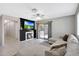 Comfortable living room with a fireplace and a sliding glass door to the outside at 17426 W Calavar Rd, Surprise, AZ 85388