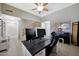 Well-lit office space featuring a desk, ceiling fan, and neutral decor at 17426 W Calavar Rd, Surprise, AZ 85388