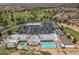 Expansive aerial view of the community clubhouse, pool, tennis courts, and golf course in a vibrant neighborhood at 17805 W Arizona Dr, Surprise, AZ 85374