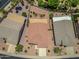 Aerial view of a home with a covered patio in a well-maintained community with lush landscaping and nearby amenities at 17805 W Arizona Dr, Surprise, AZ 85374