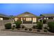 A cozy backyard featuring a covered patio and a charming desert landscape with green shrubs at 17805 W Arizona Dr, Surprise, AZ 85374
