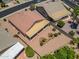 The backyard is beautifully landscaped with desert plants and features a large, covered patio area for entertaining at 17805 W Arizona Dr, Surprise, AZ 85374