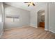 Bedroom featuring wood floors and a view of the bathroom at 17805 W Arizona Dr, Surprise, AZ 85374