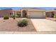 Inviting single-Gathering home featuring desert landscaping, arched entryway, and two-car garage at 17805 W Arizona Dr, Surprise, AZ 85374